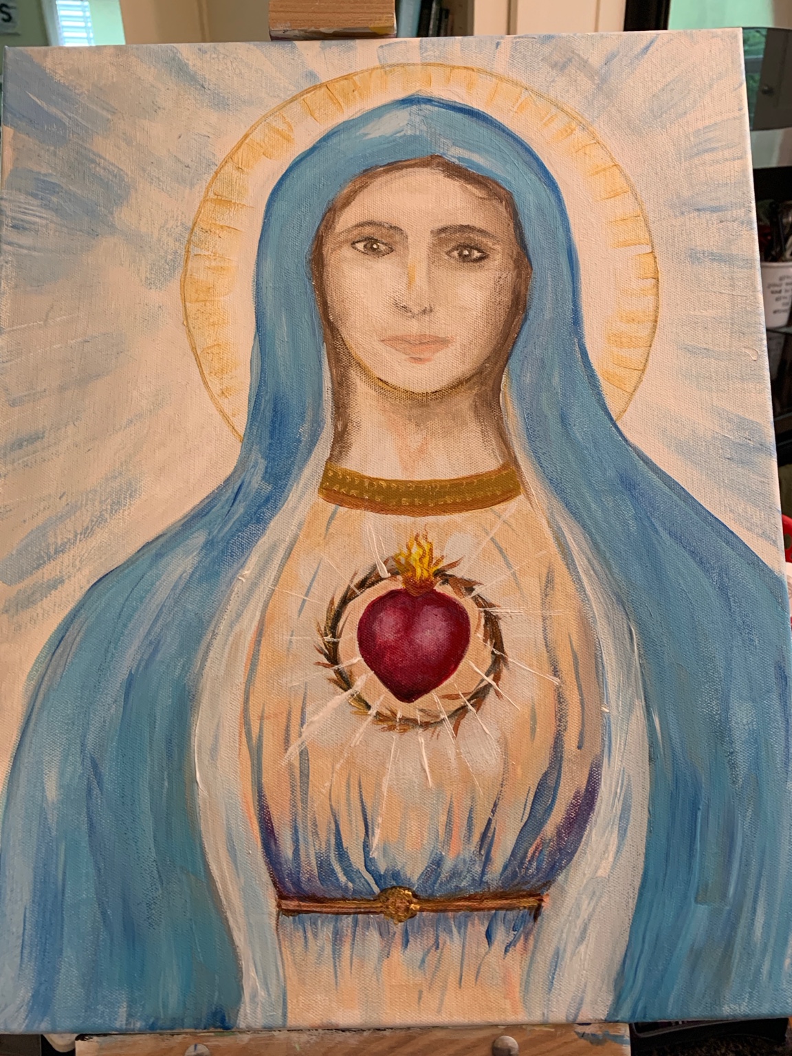 Painting of Mary in a blue veil with a radiant heart encircled by thorns