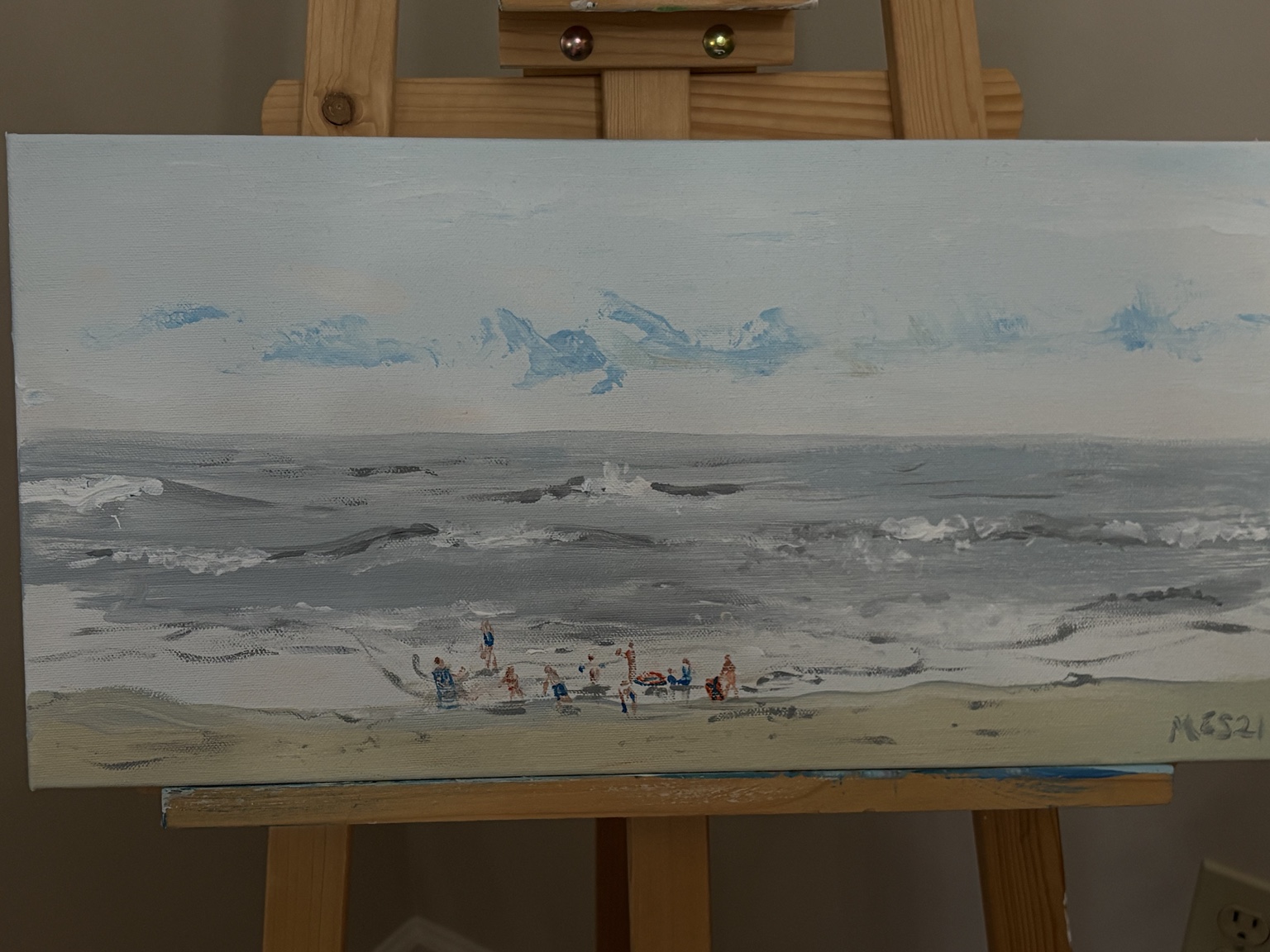 Mary's soft coastal painting of people gathered along a gray-blue shoreline